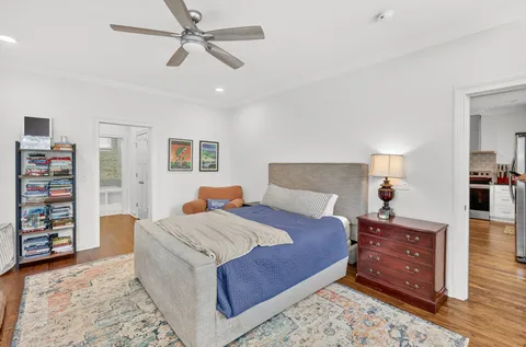 a bedroom with a bed and a dresser