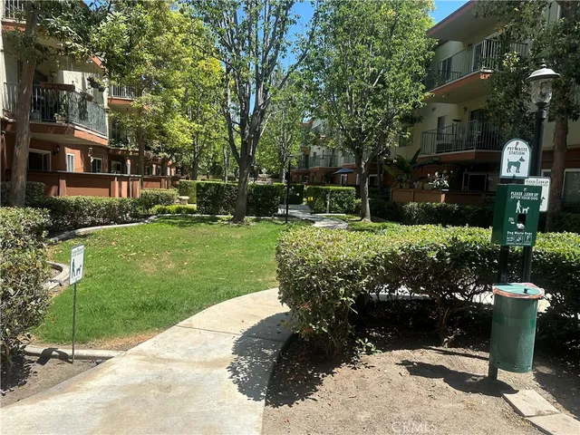 a view of a backyard with potted plants