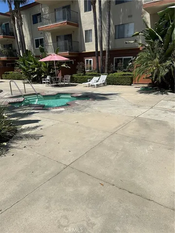 a bathroom with a shower and a sink