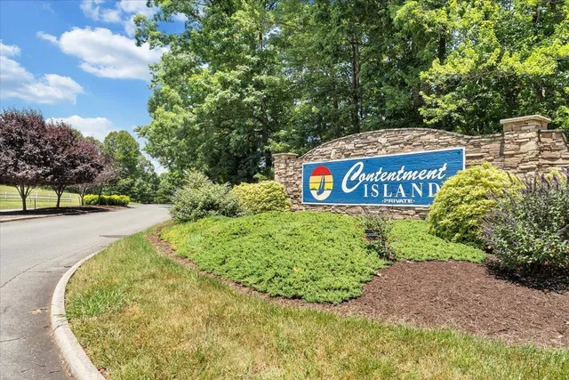 a view of outdoor space with garden and signage