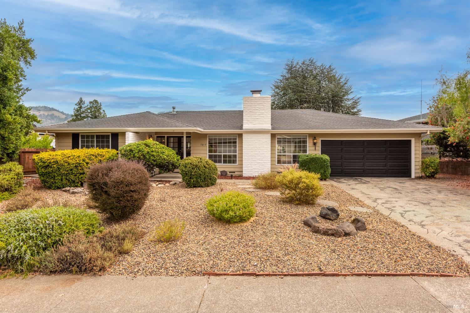 7015 Oakmont Drive Santa Rosa, CA 95409 - Photo 1 of 1 a view of a house with backyard and sitting area