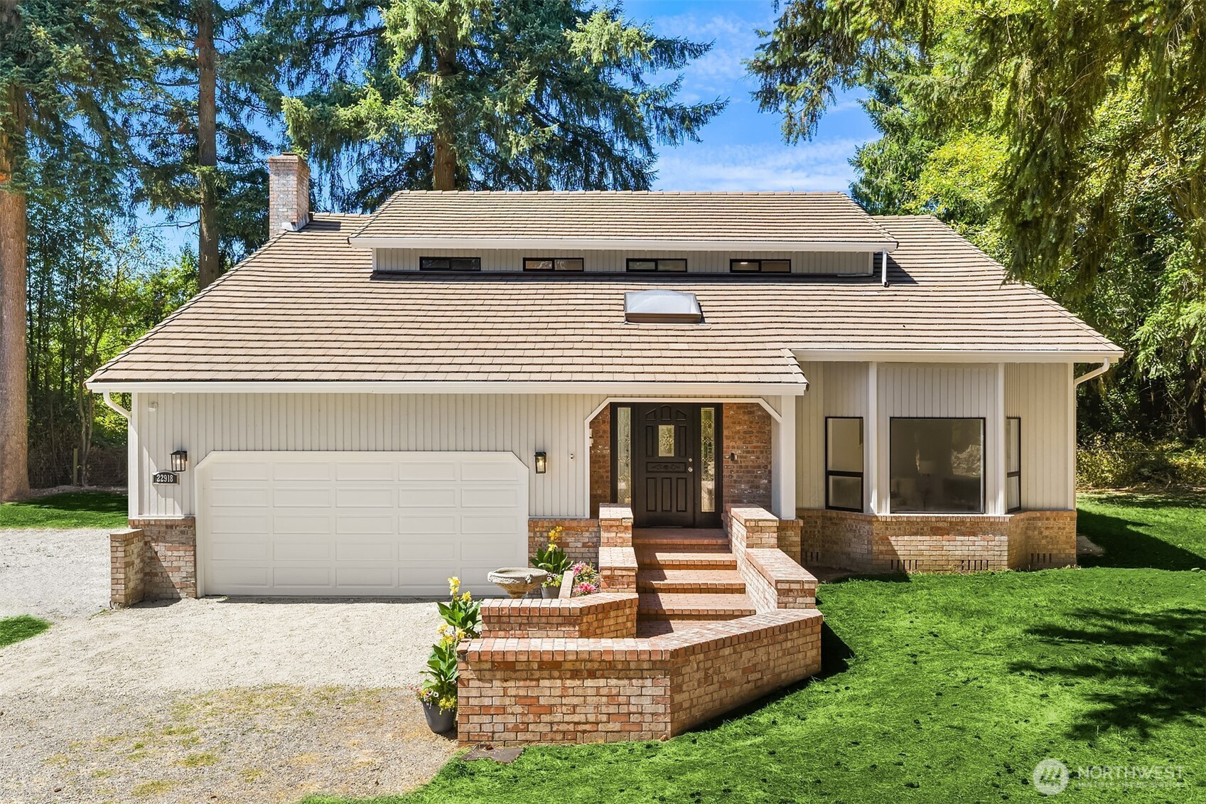 22918 49th Avenue Southeast Bothell, WA 98021 - Photo 1 of 1 a front view of a house with a yard