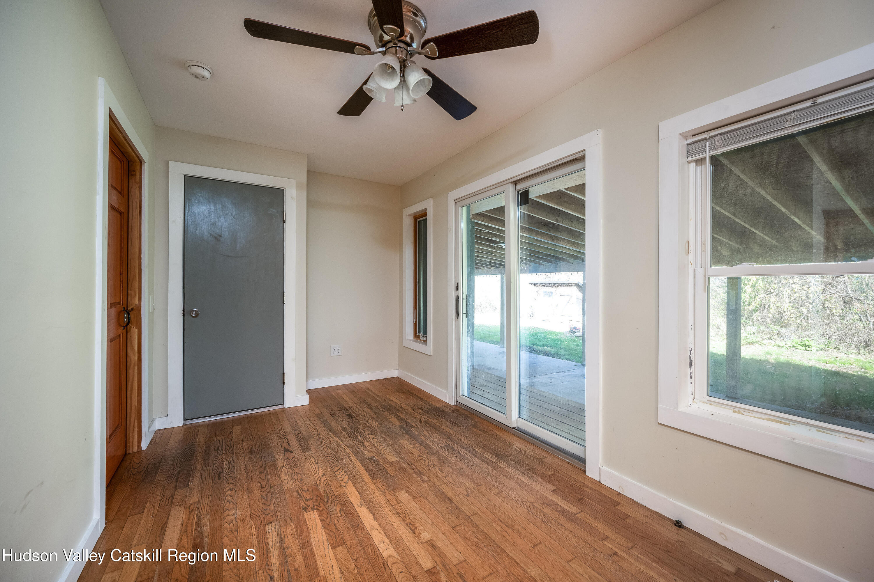 3024 Highway 213 Stone Ridge, NY 12484 - Photo 12 of 31 a view of empty room with wooden floor and fan