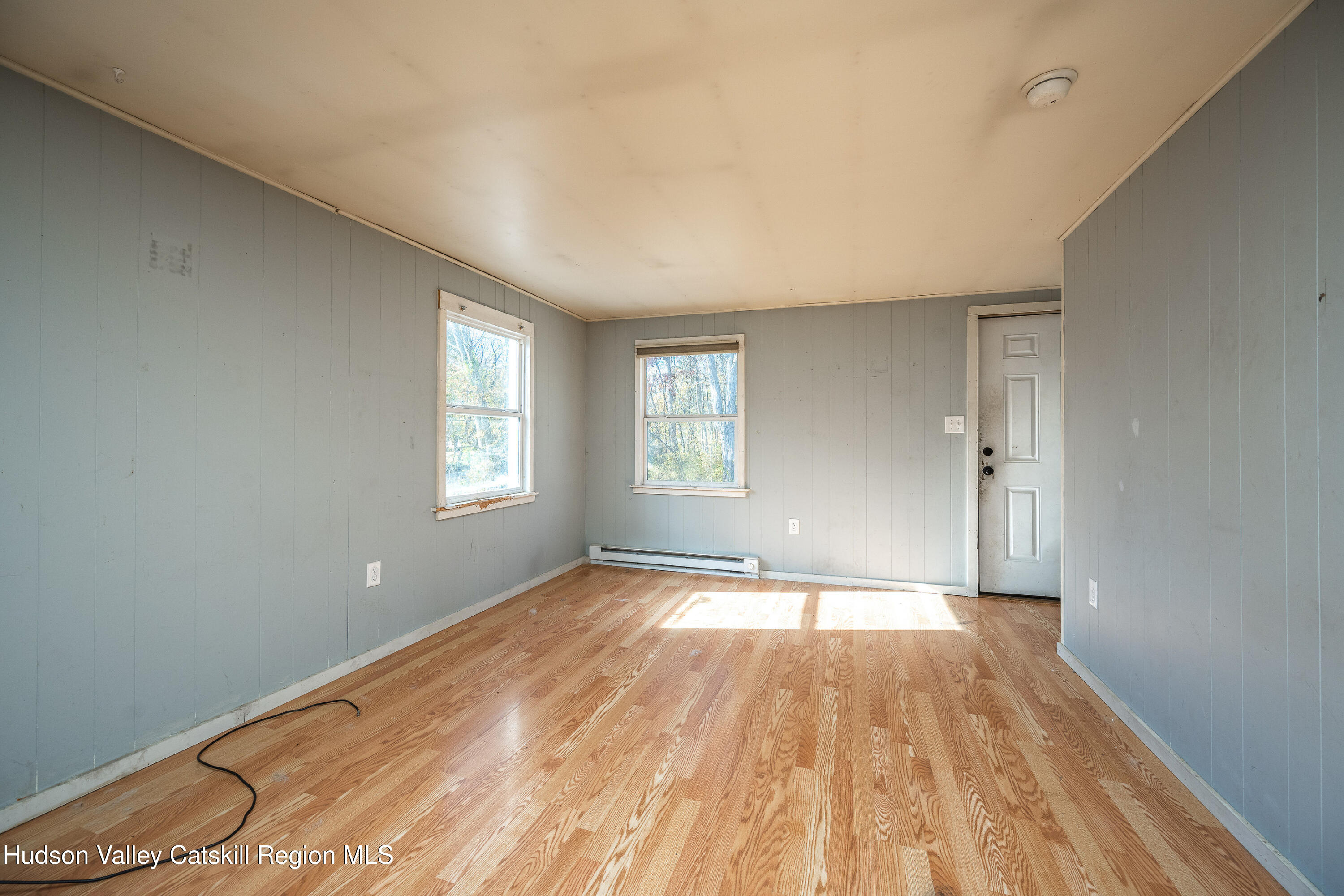 3024 Highway 213 Stone Ridge, NY 12484 - Photo 20 of 31 a view of empty room with wooden floor and fan