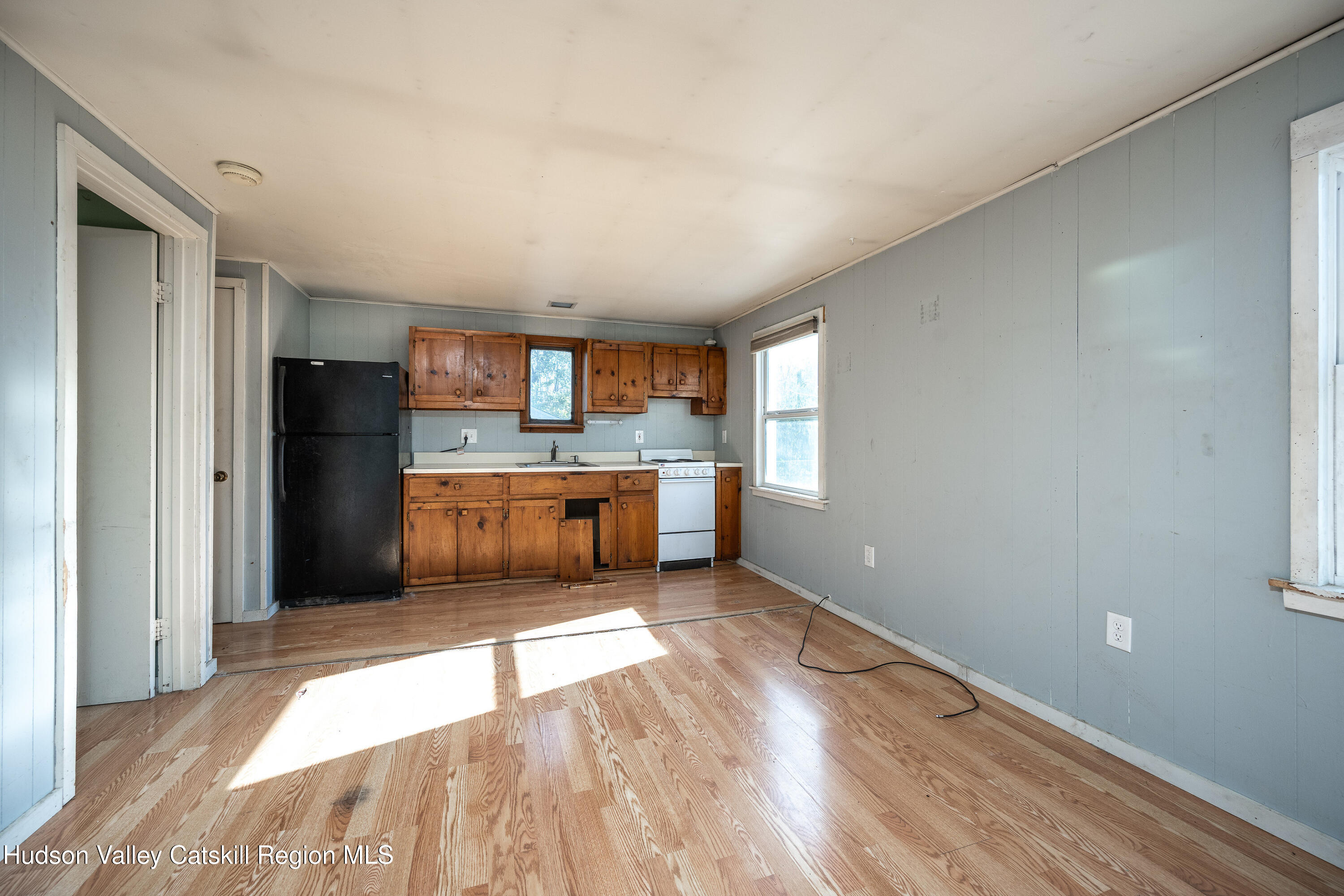 3024 Highway 213 Stone Ridge, NY 12484 - Photo 24 of 31 a kitchen with stainless steel appliances granite countertop a refrigerator and a sink