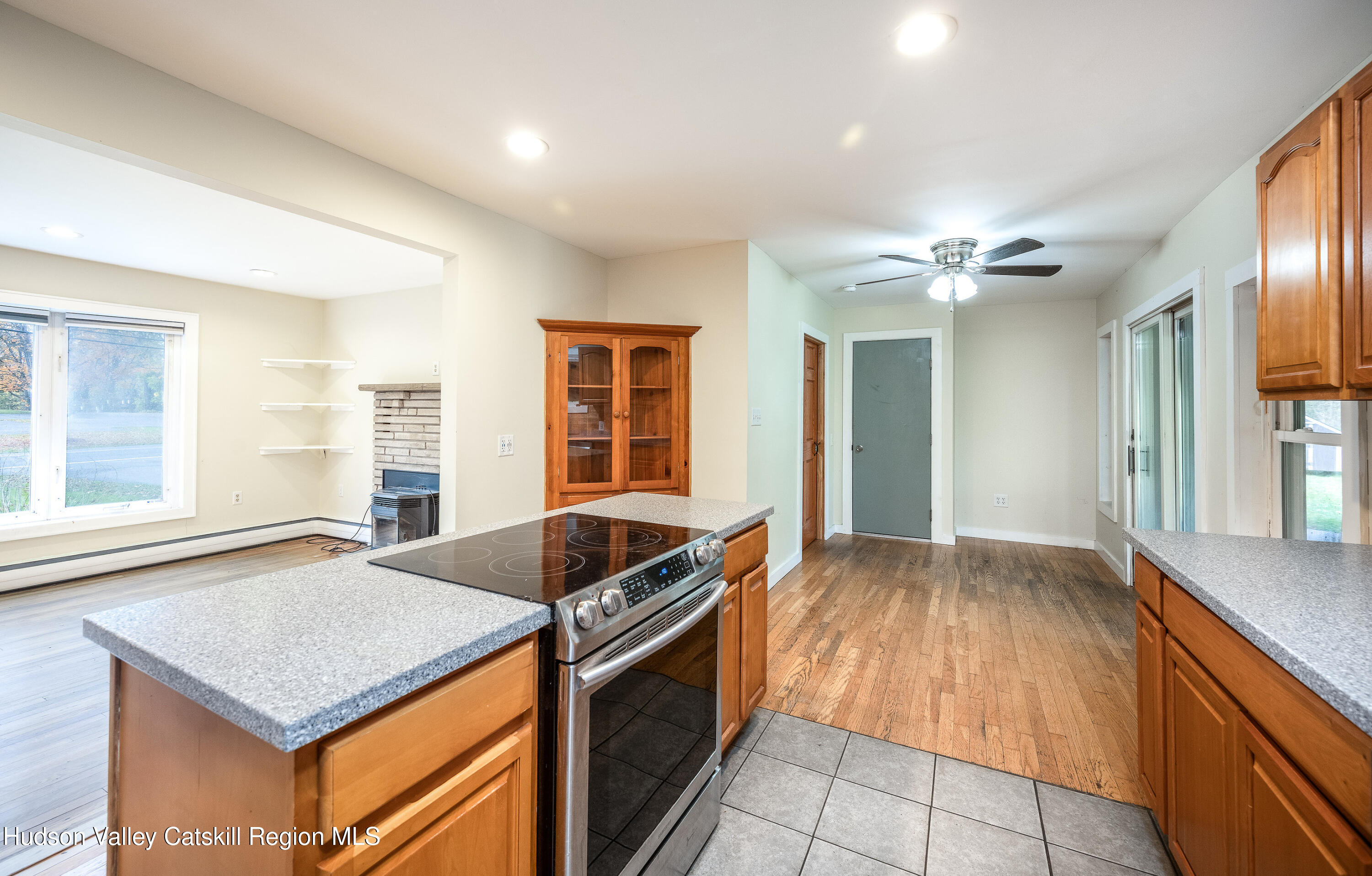 3024 Highway 213 Stone Ridge, NY 12484 - Photo 9 of 31 a kitchen with granite countertop a sink and a stove