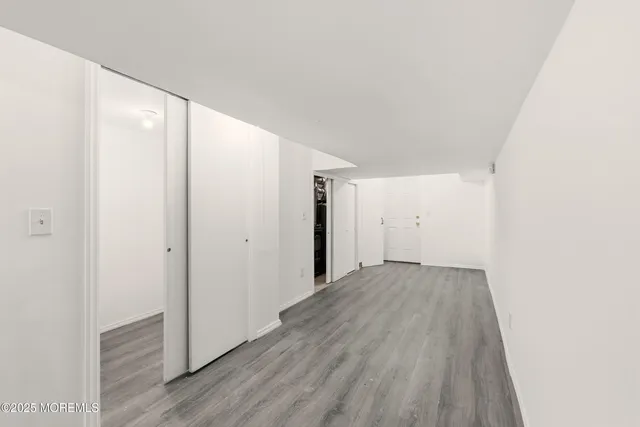 a view of a livingroom with wooden floor