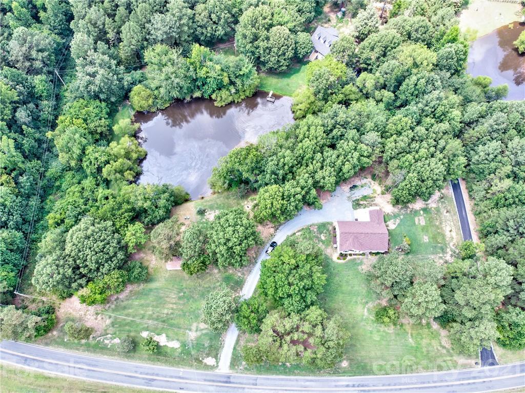 4004 Belk Mill Road Wingate, NC 28174 - Photo 1 of 44 an aerial view of a house with outdoor space and street view