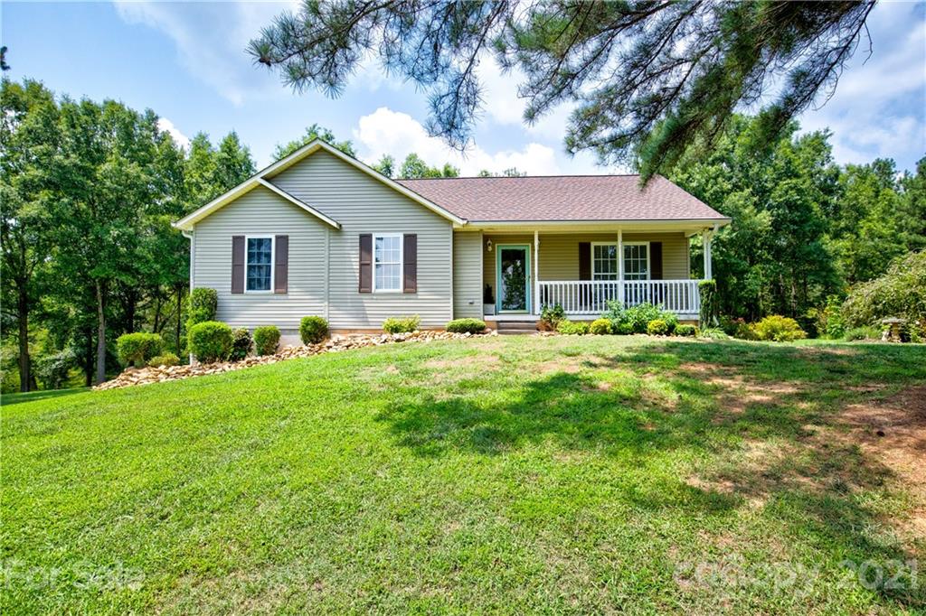 4004 Belk Mill Road Wingate, NC 28174 - Photo 2 of 44 a front view of house with yard and green space