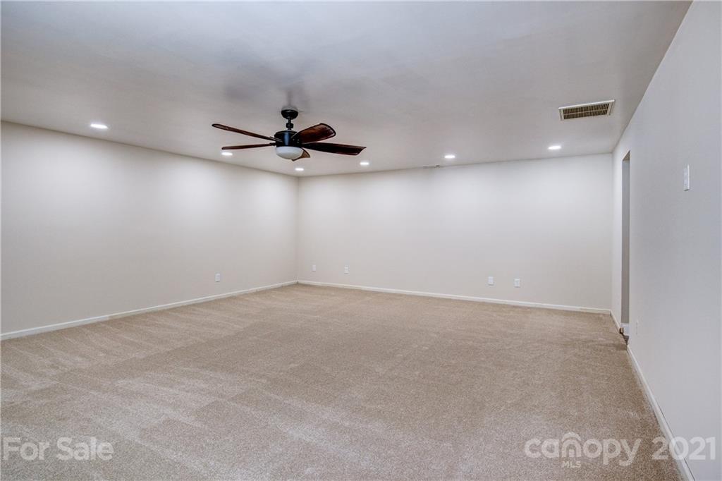 4004 Belk Mill Road Wingate, NC 28174 - Photo 24 of 44 a view of a livingroom with a ceiling fan and window