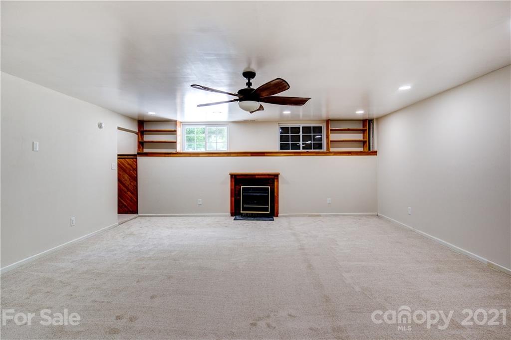 4004 Belk Mill Road Wingate, NC 28174 - Photo 25 of 44 a view of a kitchen with a sink and a ceiling fan