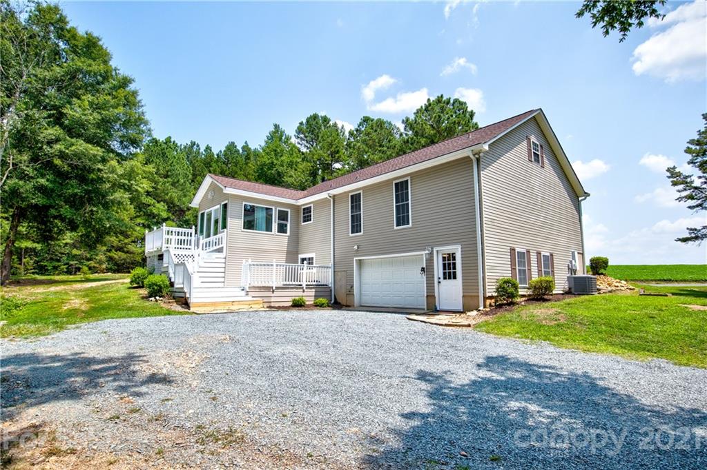 4004 Belk Mill Road Wingate, NC 28174 - Photo 27 of 44 a front view of house with yard and green space