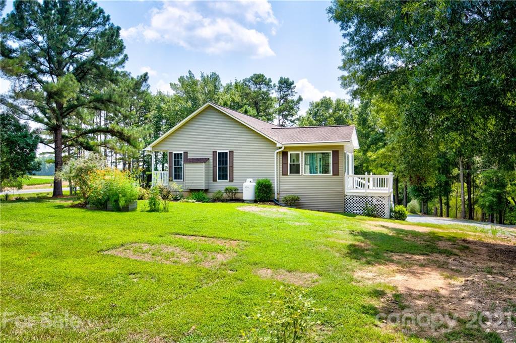 4004 Belk Mill Road Wingate, NC 28174 - Photo 29 of 44 a front view of a house with a yard