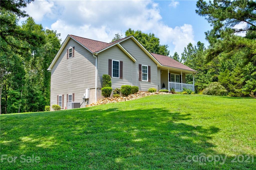 4004 Belk Mill Road Wingate, NC 28174 - Photo 4 of 44 a front view of house with yard and green space