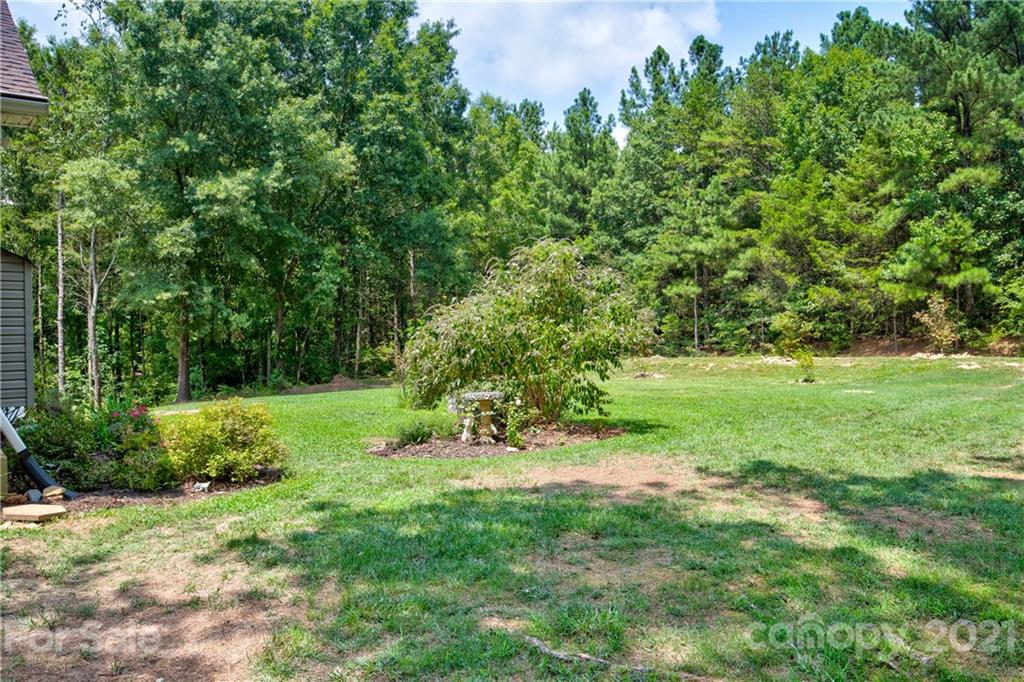 4004 Belk Mill Road Wingate, NC 28174 - Photo 32 of 44 a view of a lush green space