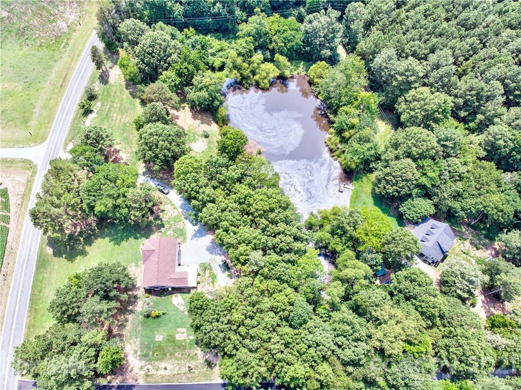 4004 Belk Mill Road Wingate, NC 28174 - Photo 39 of 44 an aerial view of a house with a yard and fountain