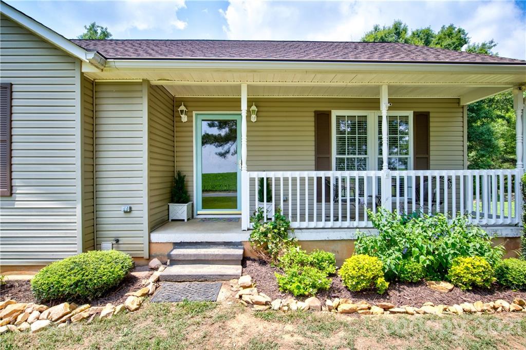 4004 Belk Mill Road Wingate, NC 28174 - Photo 5 of 44 a front view of a house having entryway