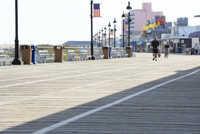 a front view of a building with a lots of traffic
