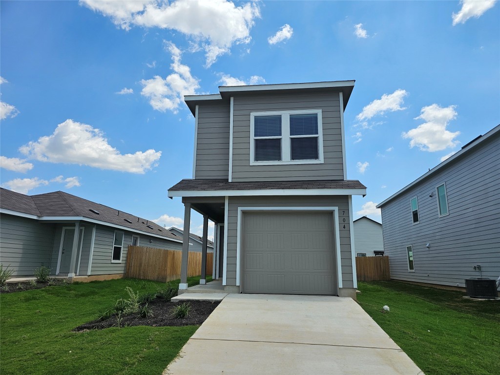 704 Commander Abbott Drive Jarrell, TX 76537 - Photo 1 of 29 a front view of a house with garden