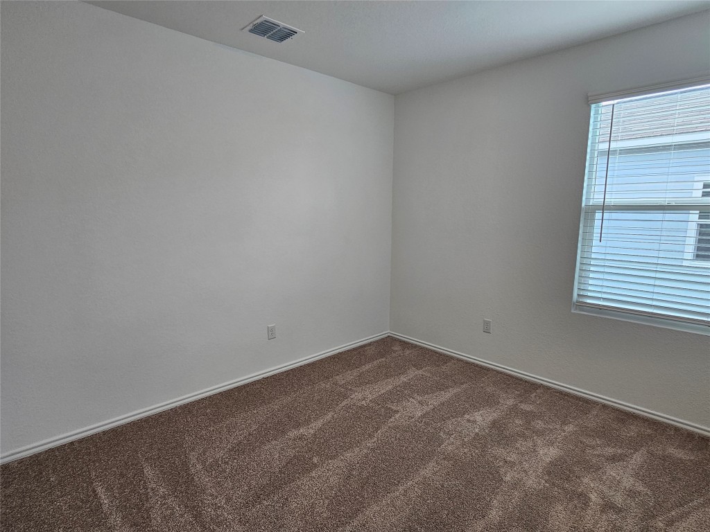 704 Commander Abbott Drive Jarrell, TX 76537 - Photo 15 of 29 an empty room with a window