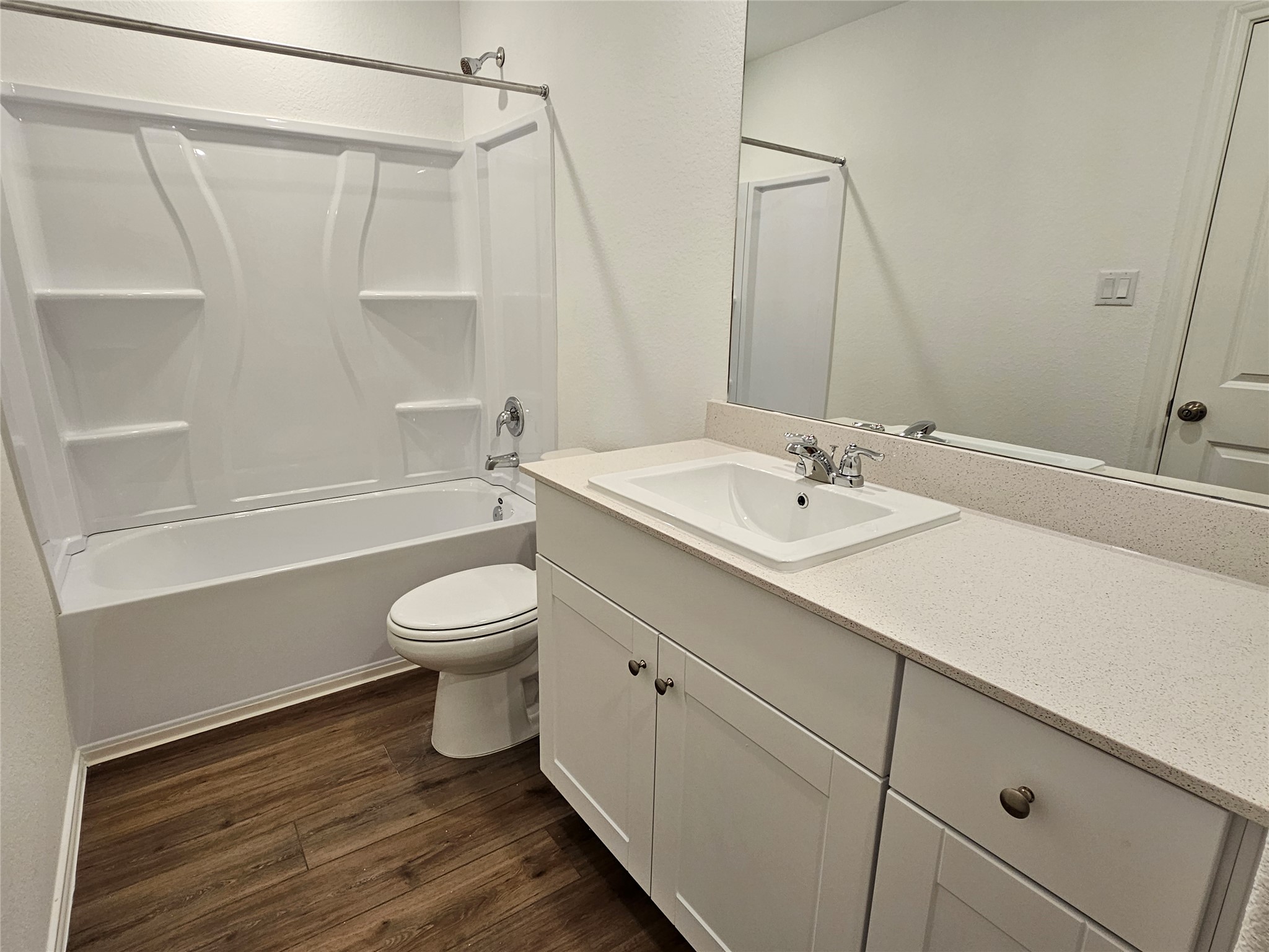 704 Commander Abbott Drive Jarrell, TX 76537 - Photo 19 of 29 a bathroom with a sink a toilet and a bathtub