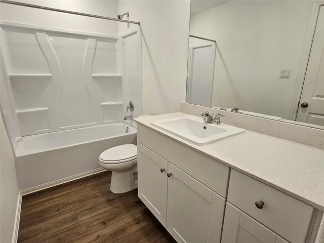 a bathroom with a sink a toilet and a bathtub