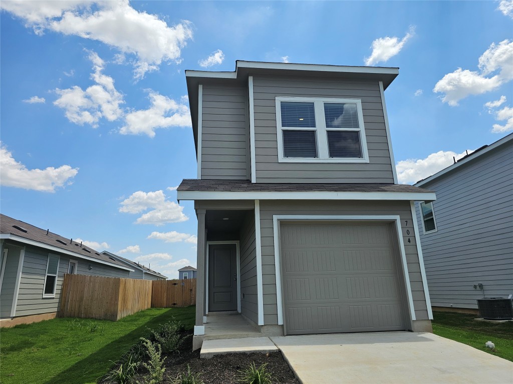704 Commander Abbott Drive Jarrell, TX 76537 - Photo 2 of 29 a front view of a house with a yard
