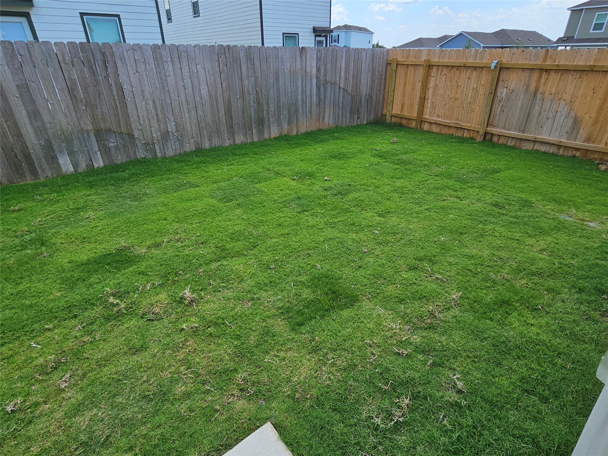 704 Commander Abbott Drive Jarrell, TX 76537 - Photo 28 of 29 a view of a backyard with barn and wooden fence