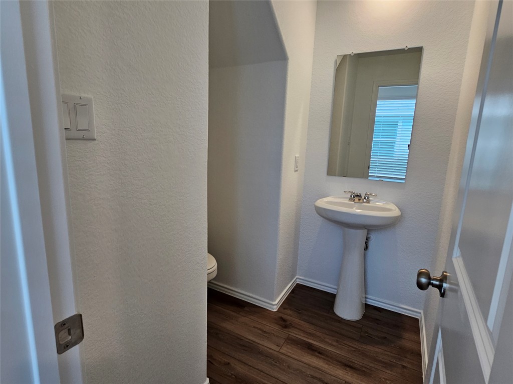 704 Commander Abbott Drive Jarrell, TX 76537 - Photo 6 of 29 a bathroom with a sink and mirror