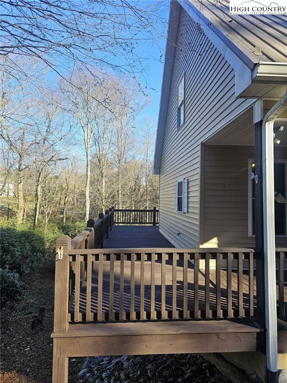 711 Trice Fork Mountain Road Newland, NC 28657 - Photo 11 of 22 a view of a brick house with a small yard