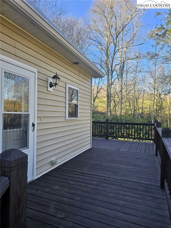 711 Trice Fork Mountain Road Newland, NC 28657 - Photo 13 of 22 a view of a wooden deck