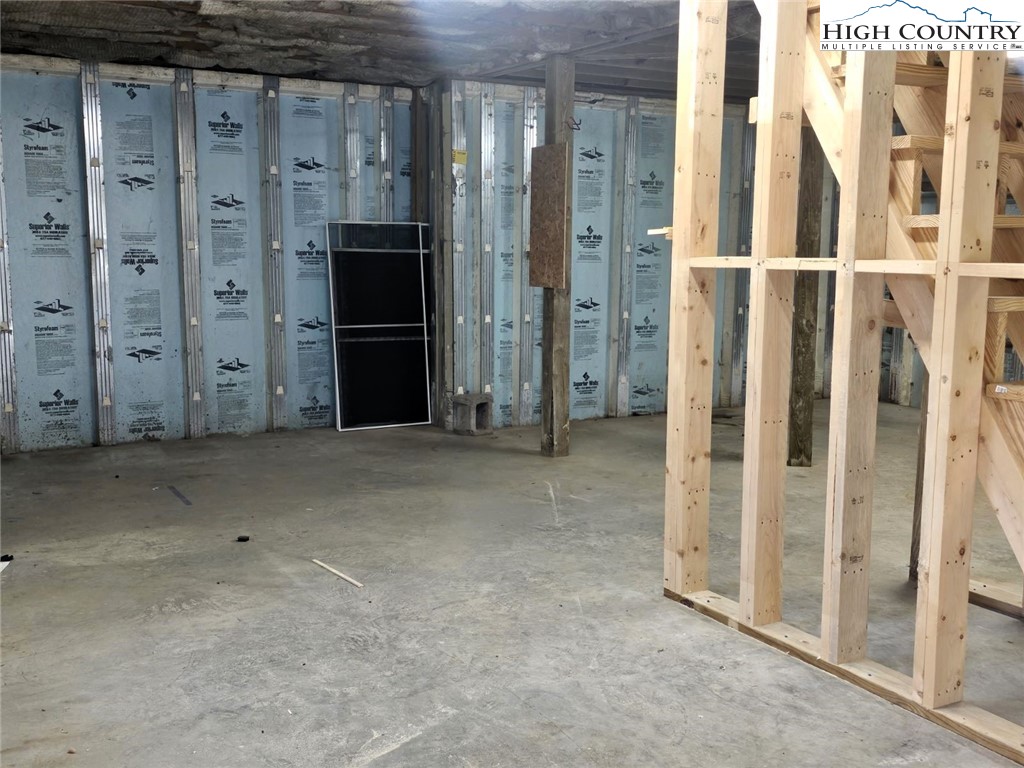 711 Trice Fork Mountain Road Newland, NC 28657 - Photo 17 of 22 a view of a hallway with wooden shelves