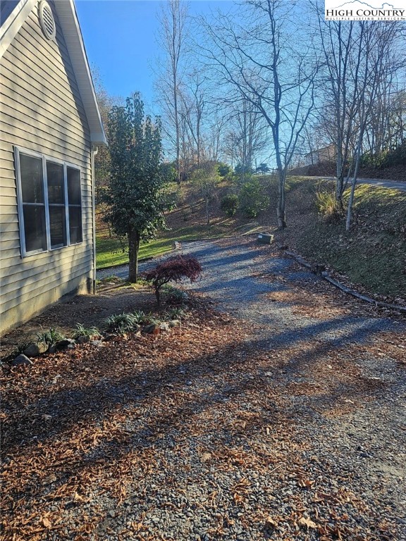 711 Trice Fork Mountain Road Newland, NC 28657 - Photo 19 of 22 a backyard of a house with lots of green space