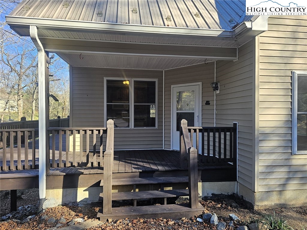 711 Trice Fork Mountain Road Newland, NC 28657 - Photo 2 of 22 a front view of a house with a bench