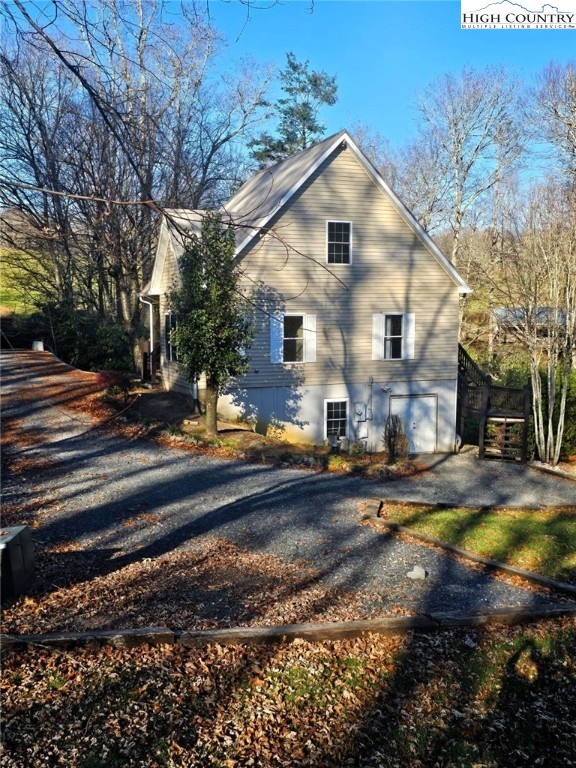 711 Trice Fork Mountain Road Newland, NC 28657 - Photo 21 of 22 front view of a house with a yard