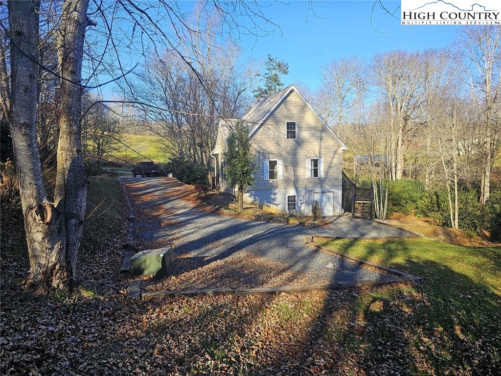 711 Trice Fork Mountain Road Newland, NC 28657 - Photo 22 of 22 a view of residential houses with trees