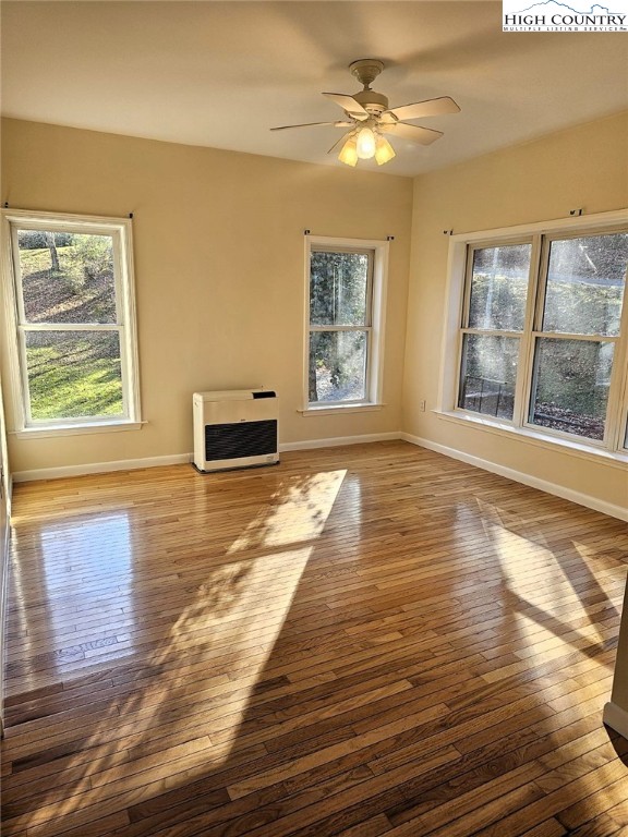 711 Trice Fork Mountain Road Newland, NC 28657 - Photo 3 of 22 a view of an empty room with wooden floor and a window
