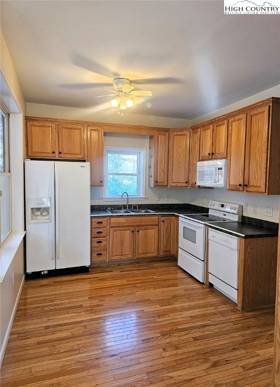 711 Trice Fork Mountain Road Newland, NC 28657 - Photo 4 of 22 a kitchen with granite countertop wooden floors stainless steel appliances a sink and a window