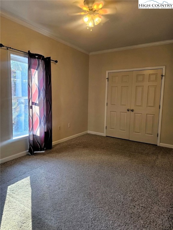 711 Trice Fork Mountain Road Newland, NC 28657 - Photo 7 of 22 an empty room with windows and closet
