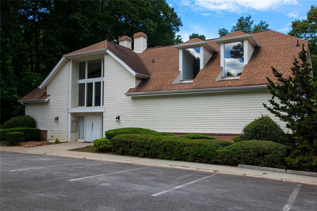 7325 Cardigan Circle Atlanta, GA 30328 - Photo 30 of 31 a front view of a house with a yard and garage