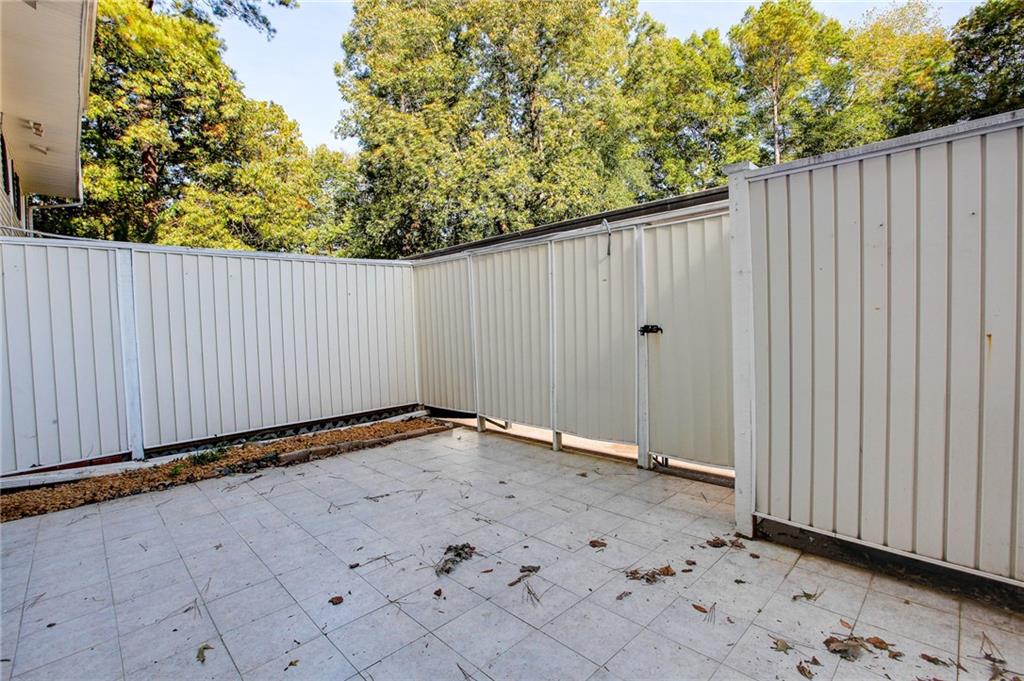 7325 Cardigan Circle Atlanta, GA 30328 - Photo 4 of 31 a view of a backyard with wooden fence