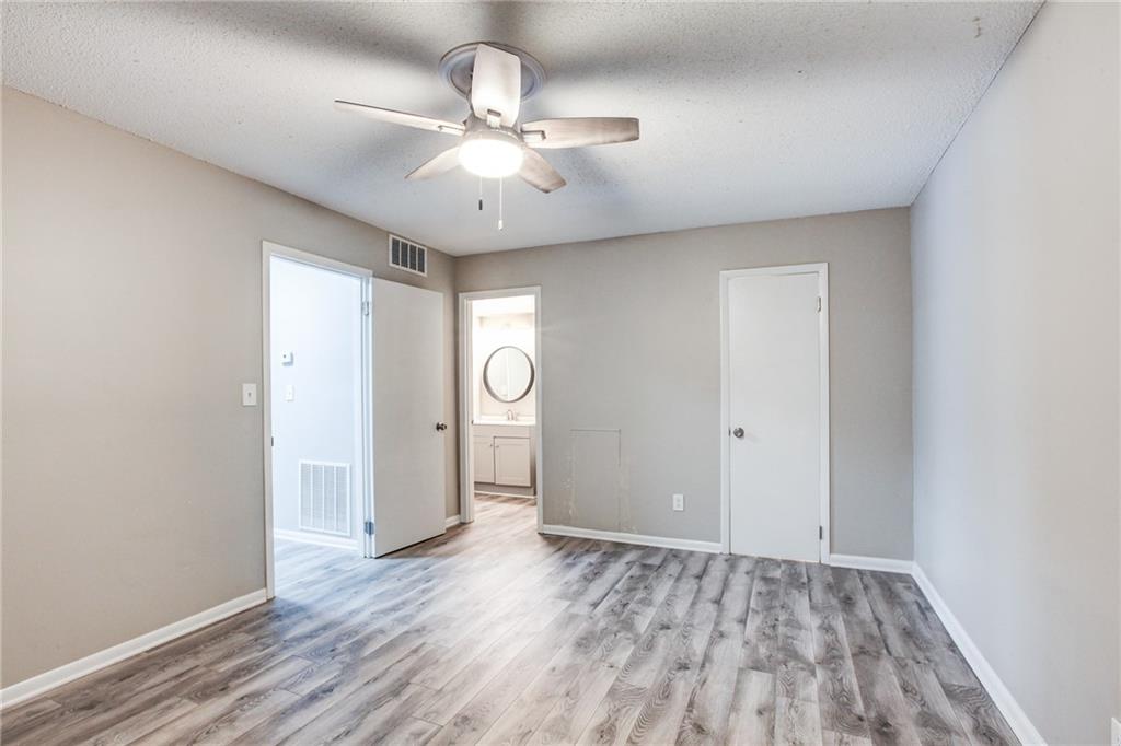 7325 Cardigan Circle Atlanta, GA 30328 - Photo 10 of 31 wooden floor in an empty room with a window