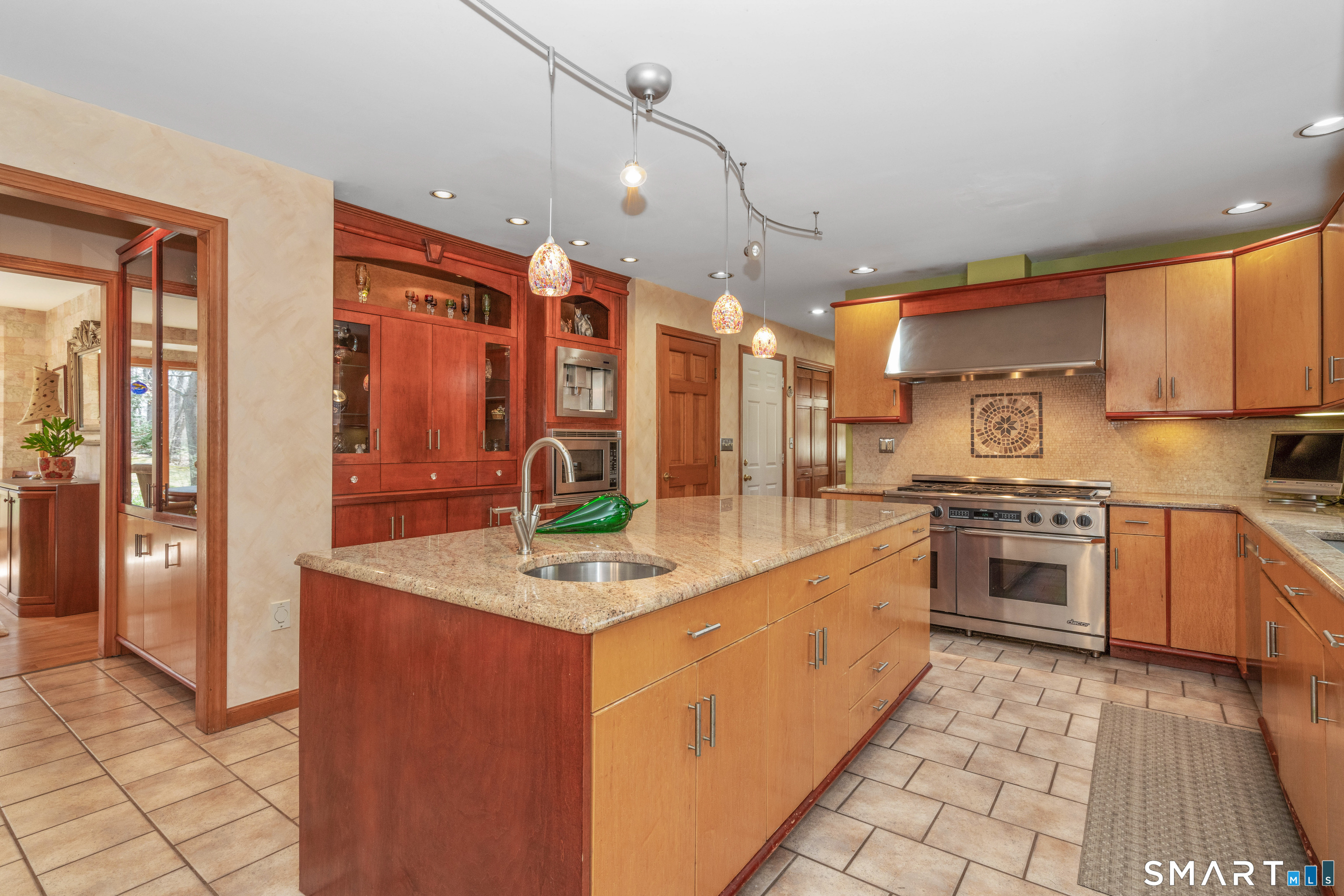 67 Hunter's Crossing Burlington, CT 06013 - Photo 7 of 35 a kitchen with stainless steel appliances granite countertop a sink a stove and a refrigerator