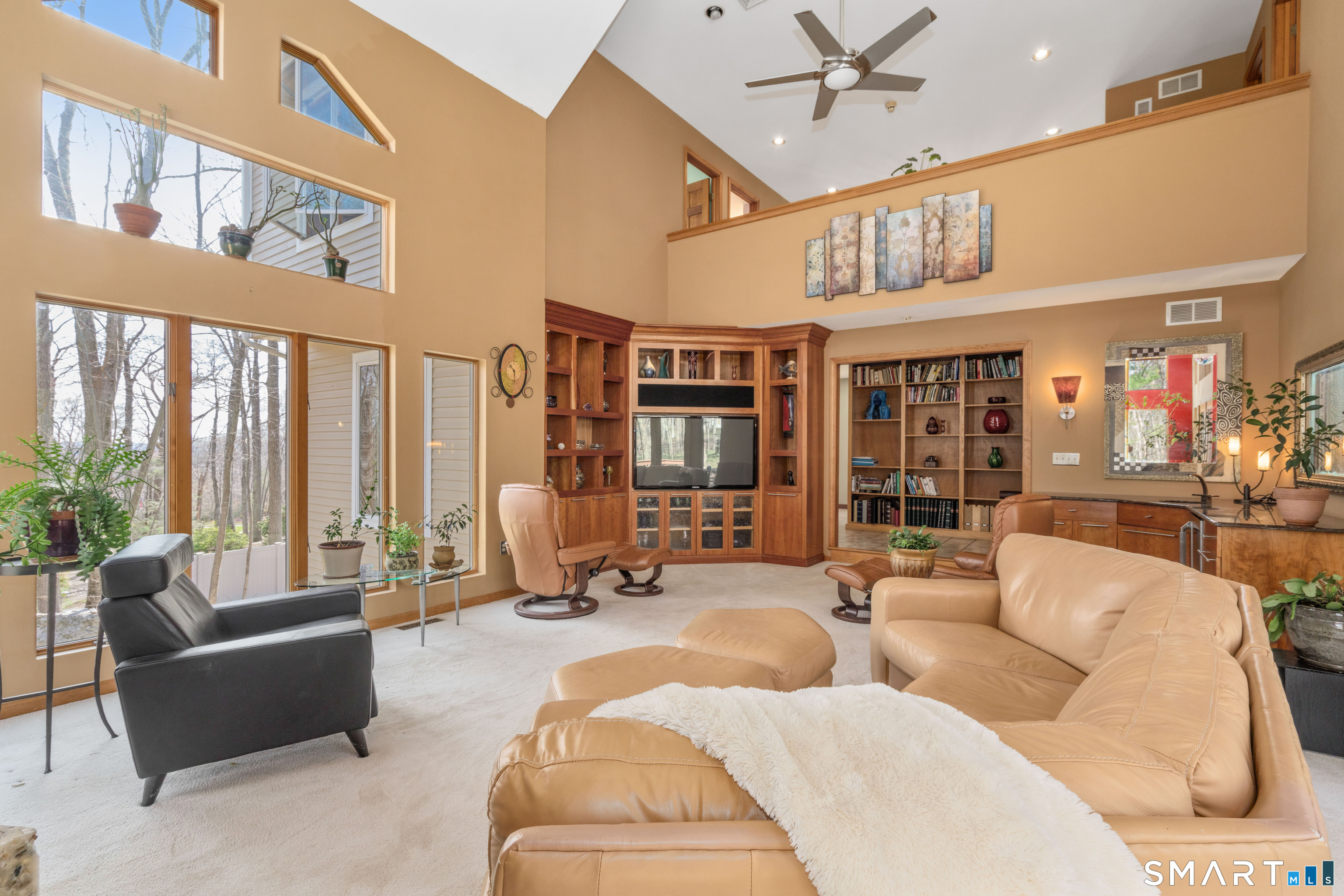 67 Hunter's Crossing Burlington, CT 06013 - Photo 10 of 35 a living room with furniture or couch and a chandelier
