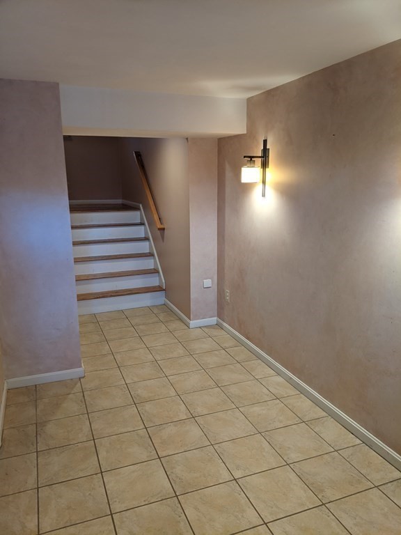 44 Boxford Road, Unit 44 Haverhill, MA 01835 - Photo 12 of 13 a view of an empty room and wooden door