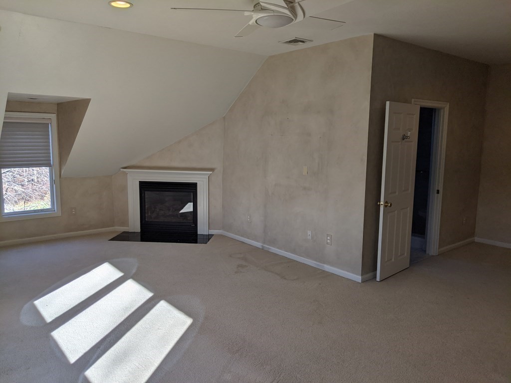 44 Boxford Road, Unit 44 Haverhill, MA 01835 - Photo 6 of 13 an empty room with windows