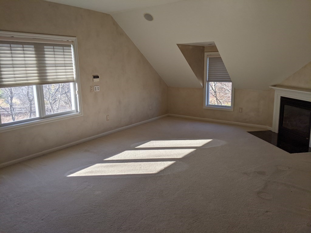 44 Boxford Road, Unit 44 Haverhill, MA 01835 - Photo 7 of 13 an empty room with a empty space and windows