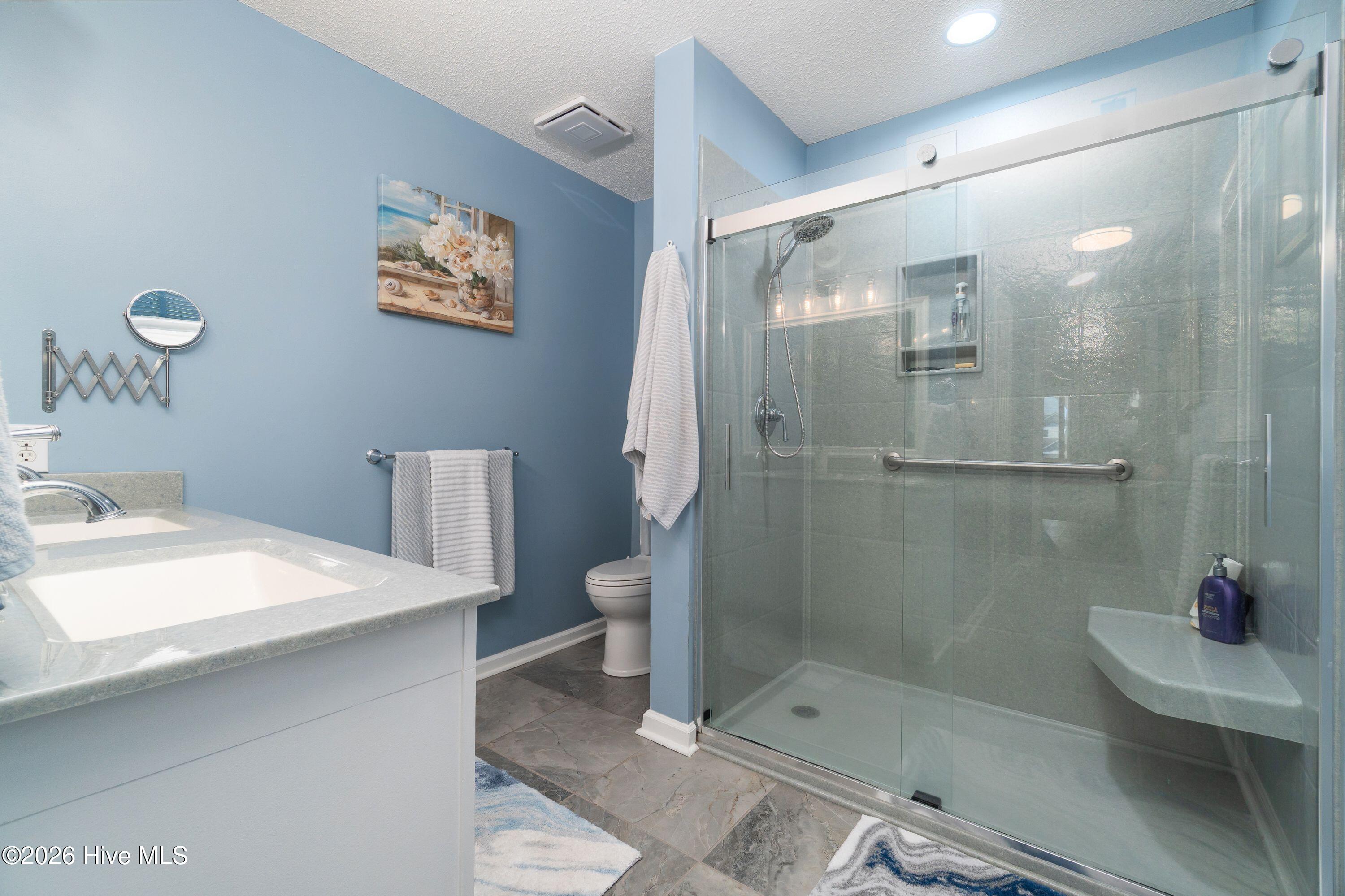330 Cape Lookout Loop Emerald Isle, NC 28594 - Photo 37 of 80 updated Master bath with new shower and sink and floor and paint !