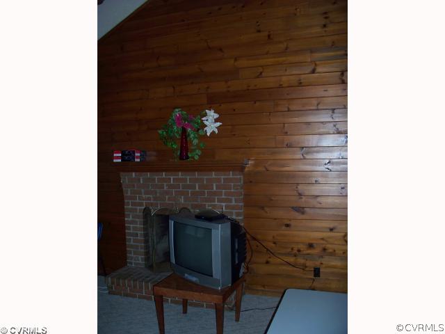 4700 Brookridge Road Chesterfield, VA 23832 - Photo 3 of 8 a living room with furniture and a fireplace