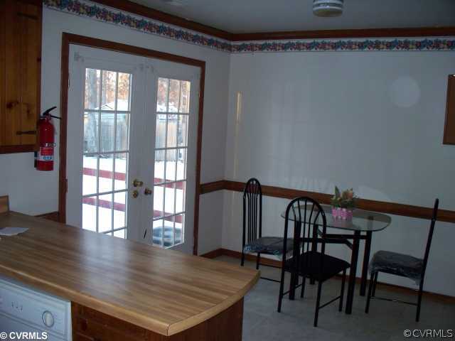 4700 Brookridge Road Chesterfield, VA 23832 - Photo 8 of 8 a view of a dining room with furniture and wooden floor